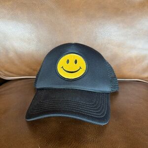 Black Trucker Hat with Yellow Smiley Patch
